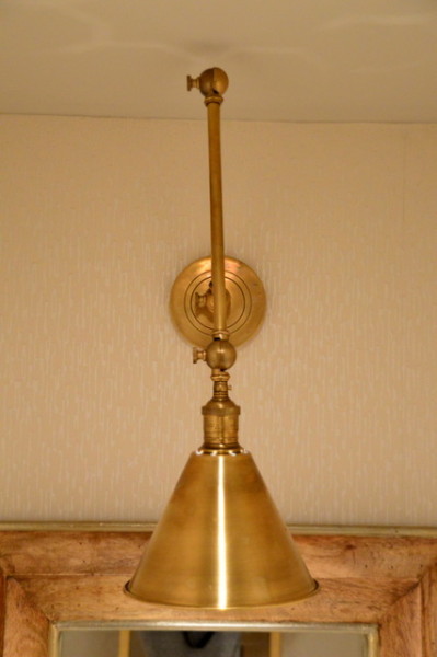 Our brass swing arm sconce