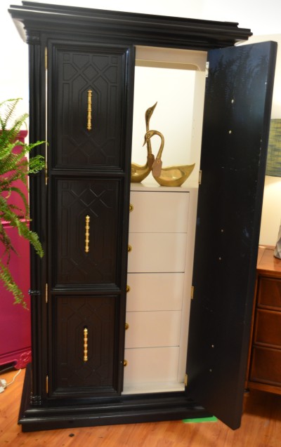 Unique double-door armoir with built-in storage.