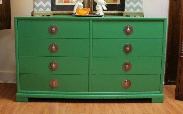 An example of a lacquered dresser with funky hardware pulls.